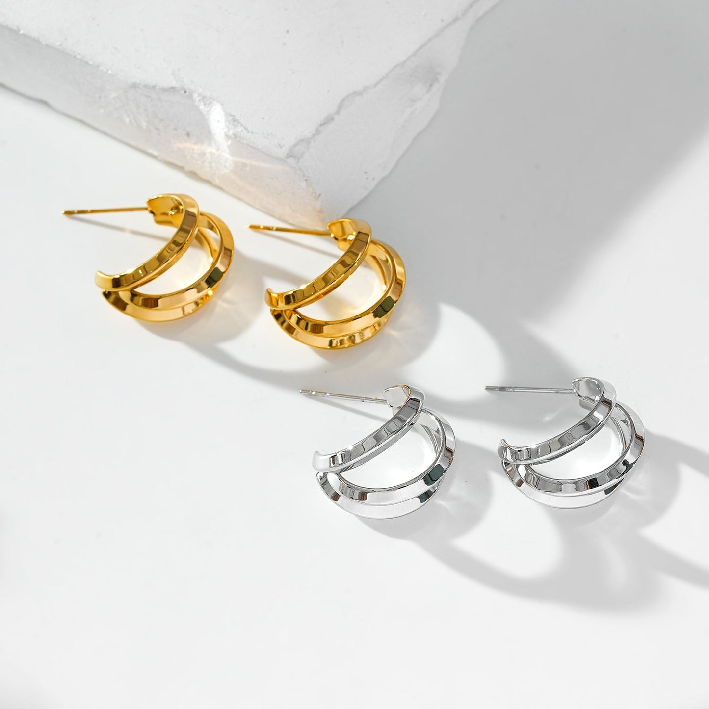 GRIZZANA: Triple Banded Hoop Earrings in Silver