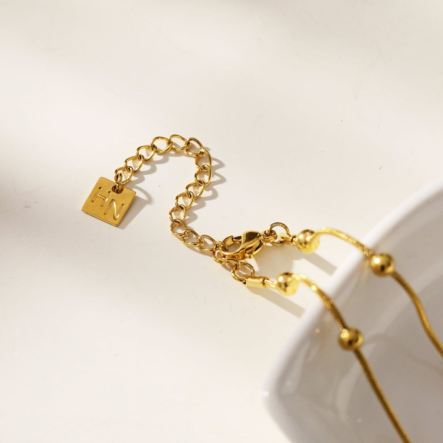 MAKARIA: Snake-Skin Textured Chain Necklace with Ball Shaped Beads