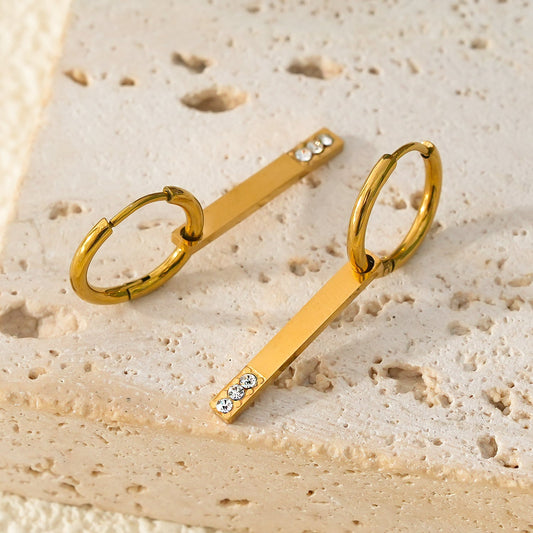 Style MAYLA: Gold Hoops with a Minimalist Charm featuring a Trio of Zirconia Gemstones