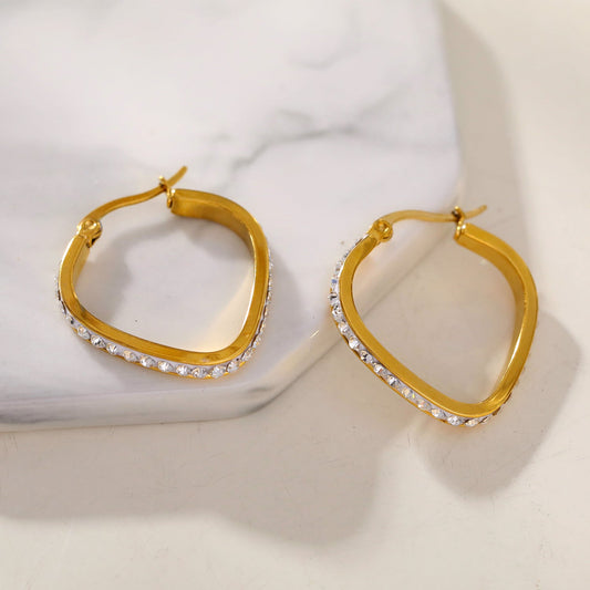 Style MELFI Gold: Abstract Heart Shaped Hoops embedded with Zirconia Gemstones