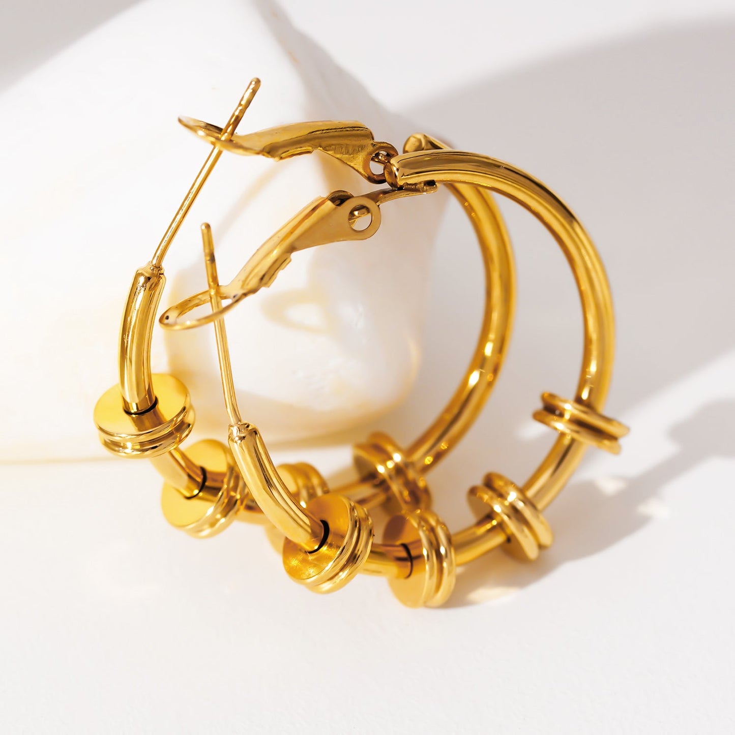 MINATO: Modernist Hoop Earrings Anchoring Industrial-Chic Double Discs.