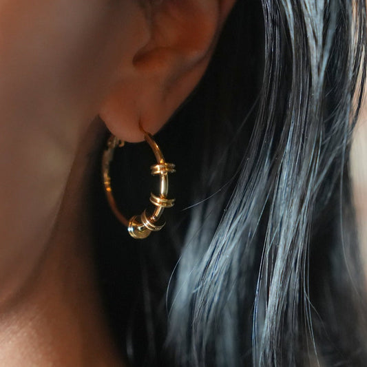 MINATO: Modernist Hoop Earrings Anchoring Industrial-Chic Double Discs.