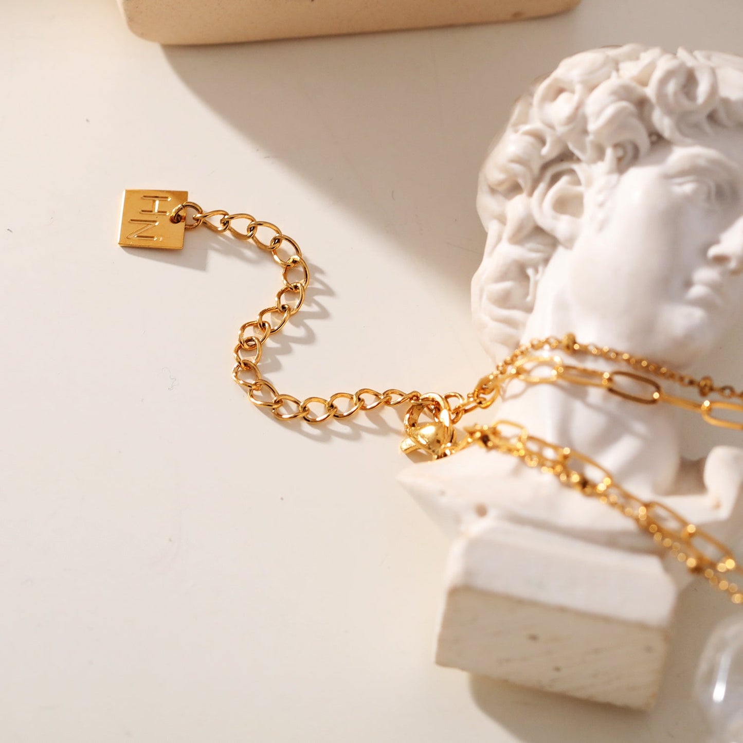 KATERI Gold: Pre-Layered Chains Necklace with a Solitaire Zirconia Charm Pendant