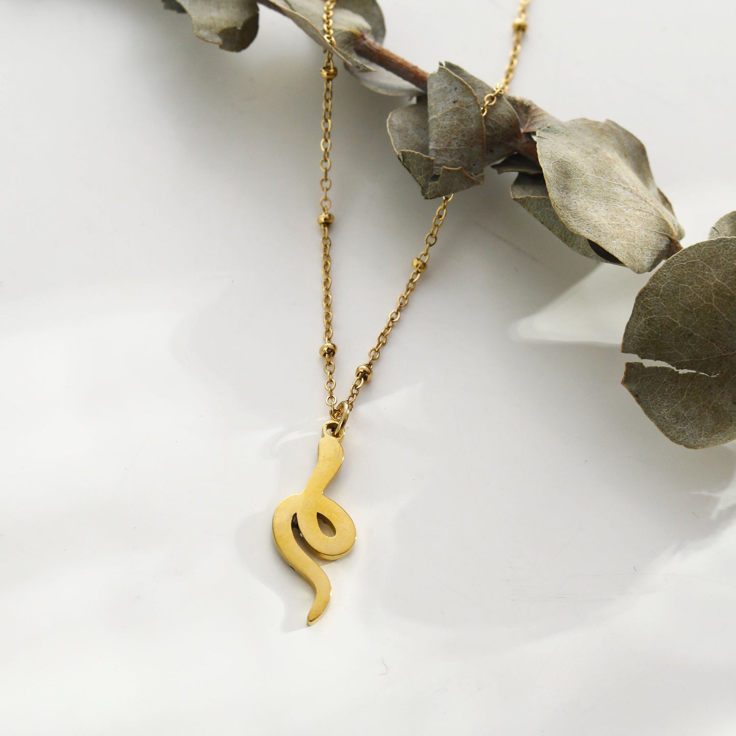 RIHANNA Beaded Chain Necklace with a Pavé Zirconia Serpent Pendant in Gold