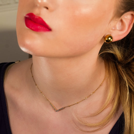 SANITA: Beaded Dainty Chain Anchoring 'V' Shaped Zirconia Embedded Pendant Charm