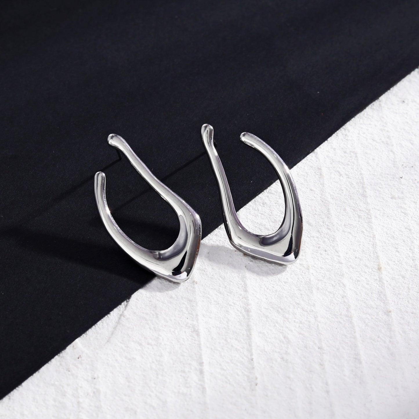 TARAJI Abstract Shaped Hoop Earrings in Silver