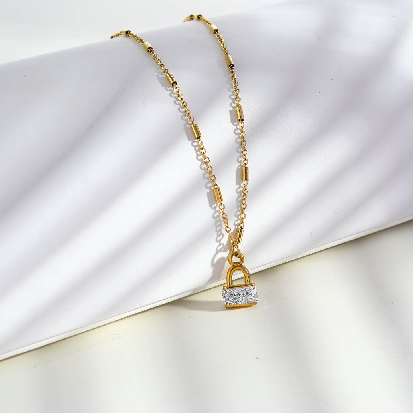 Style ABENI: Pavé Zirconia Pad Lock Pendant on a Tube Bead Chain Necklace in Gold