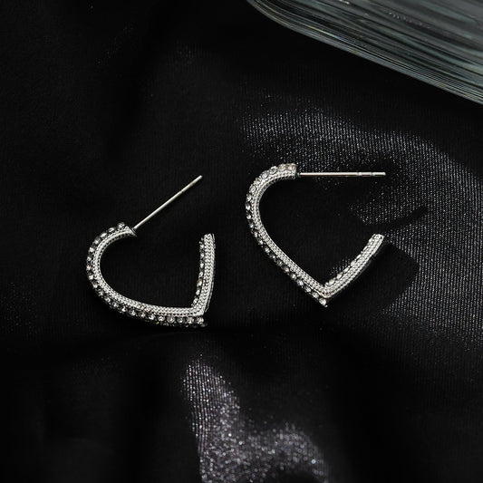Style ANJAR White Gold (Silver Tone): Heart Shaped Hoops embedded with Zirconia Gemstones