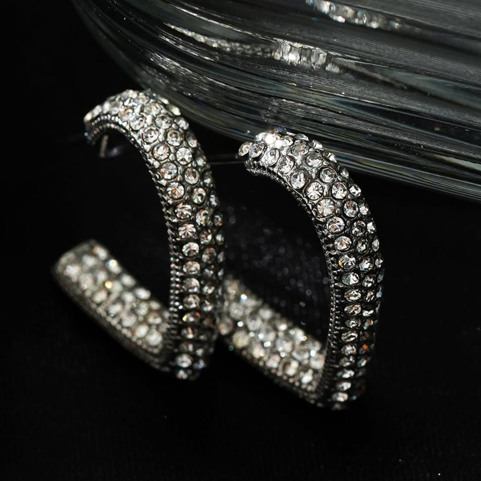 Style ANJAR White Gold (Silver Tone): Heart Shaped Hoops embedded with Zirconia Gemstones