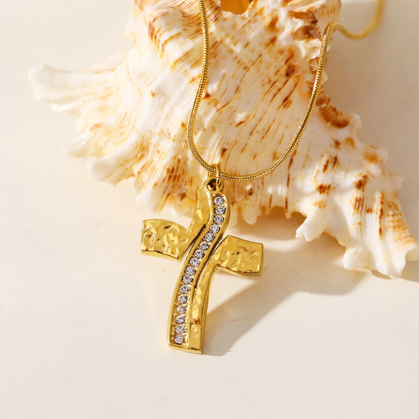 ARCASSA: Zirconia Embedded Hammered Finish Cross Pendant on a Mini Snake Skin Textured Chain Necklace.