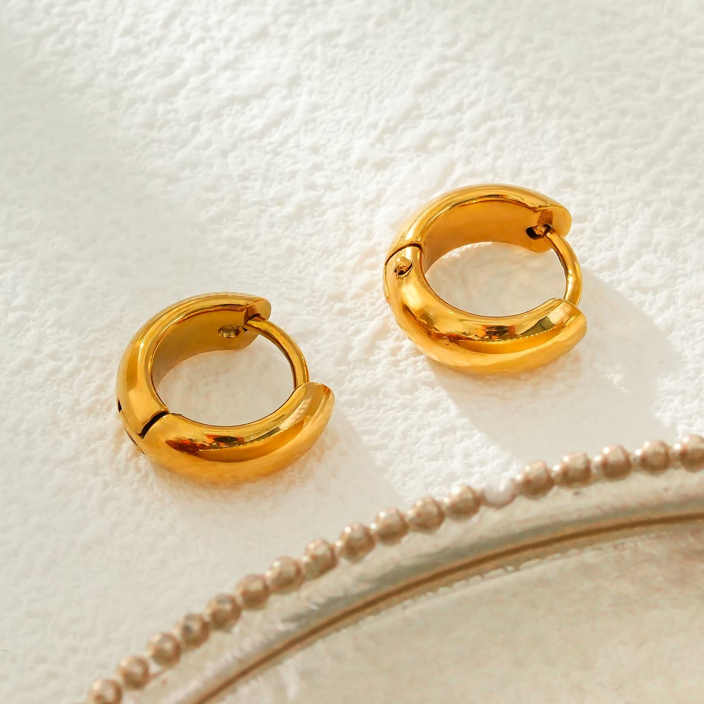 BOCHUM: Barely There, But Beautifully Noticeable Tiny Hoops in Gold