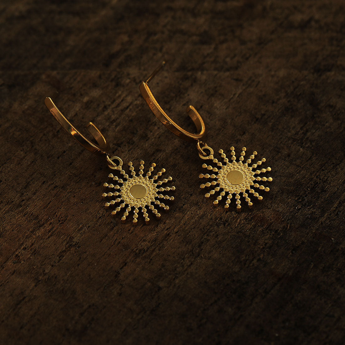 CHARLIE Gold: Semi Hoops with a Sun Symbol Charm