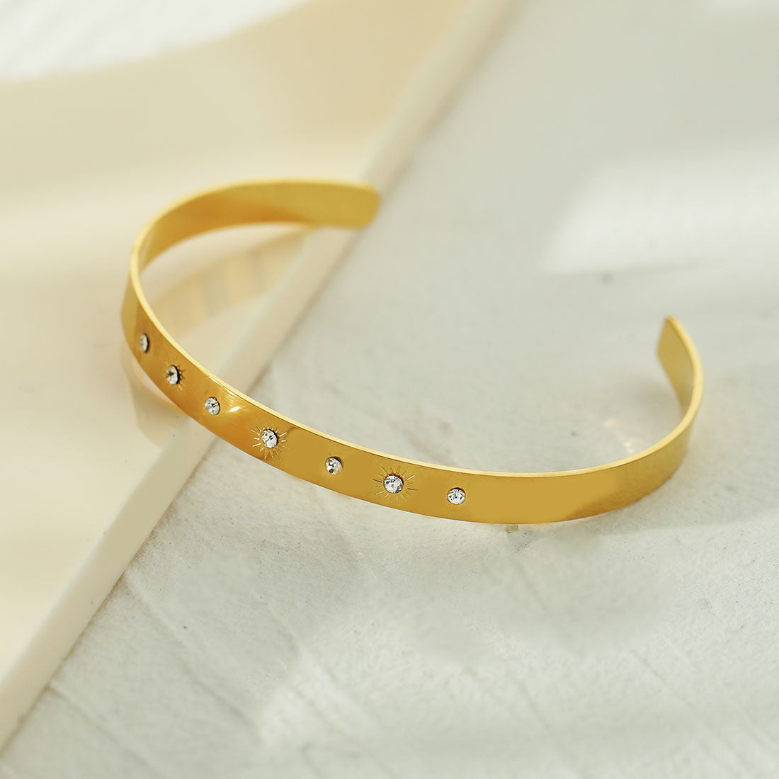 CHIMAKAK: Star-Engraved Zirconia Embedded Band Bracelet in Gold