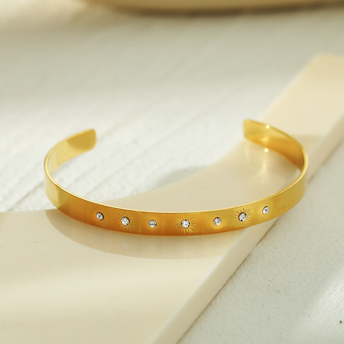 CHIMAKAK: Star-Engraved Zirconia Embedded Band Bracelet in Gold