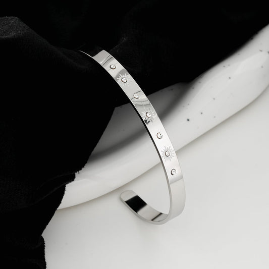 CHIMAKAK: Star-Engraved Zirconia Embedded Band Bracelet in Silver Toned White Gold
