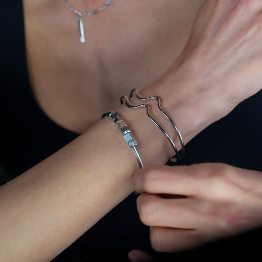 CHITRA: Industrial-Chic Bracelet with Abstract Shaped Parallel Bands in Silver Toned White Gold
