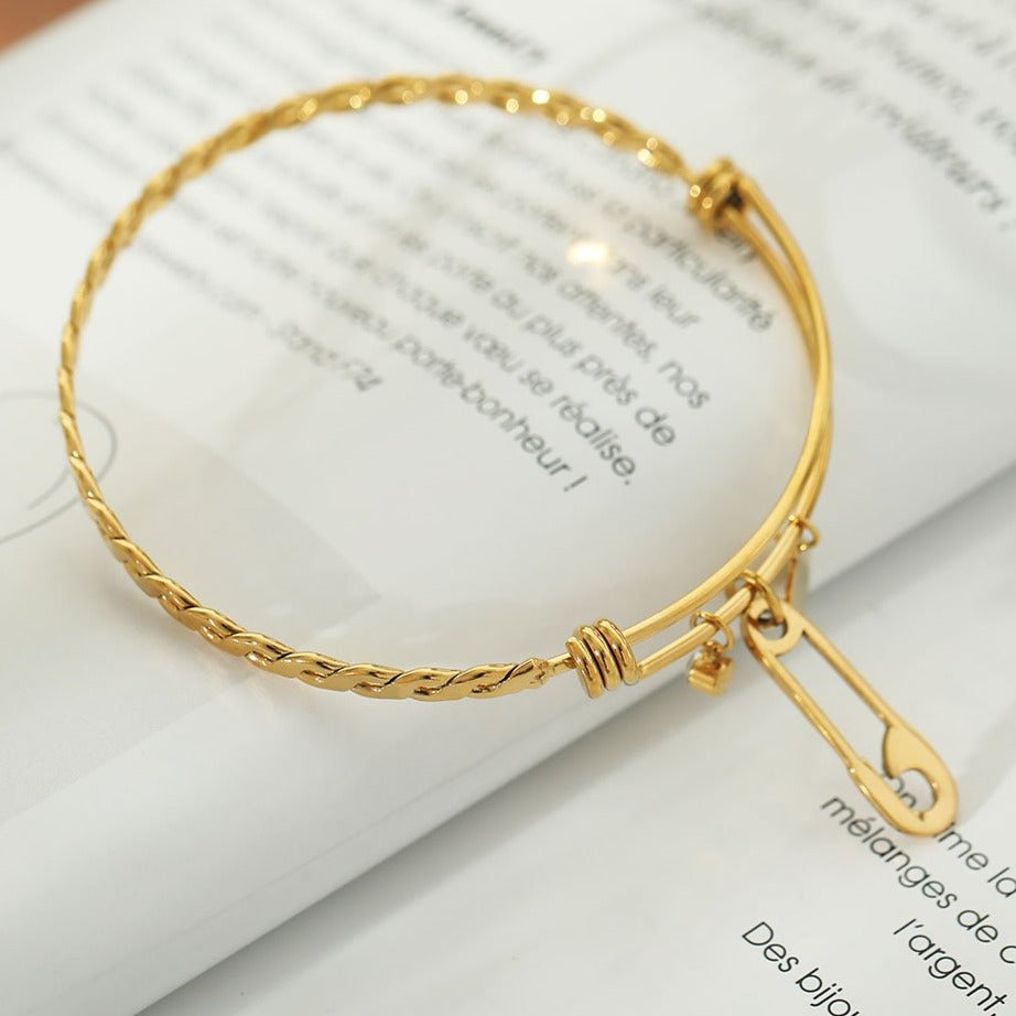 CHRISTINA: Charms Adorned Gold Bracelet