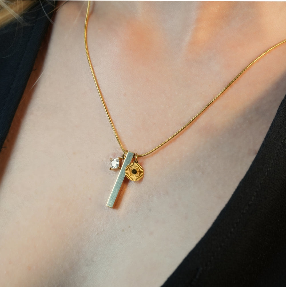 Style DEFNIE: Snake-Skin textured Dainty Chain Necklace Anchoring a Trio of Charms