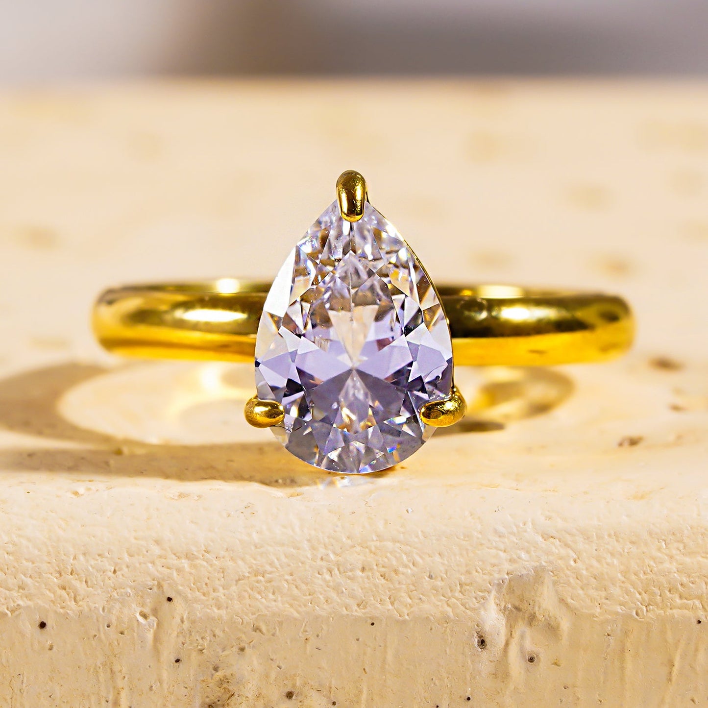 DIMONDA: Classic Gold Ring with Prominent Teardrop Zirconia Centerpiece