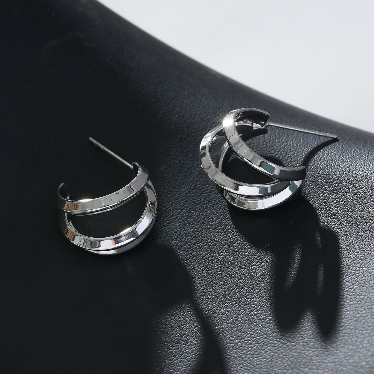 GRIZZANA: Triple Banded Hoop Earrings in Silver