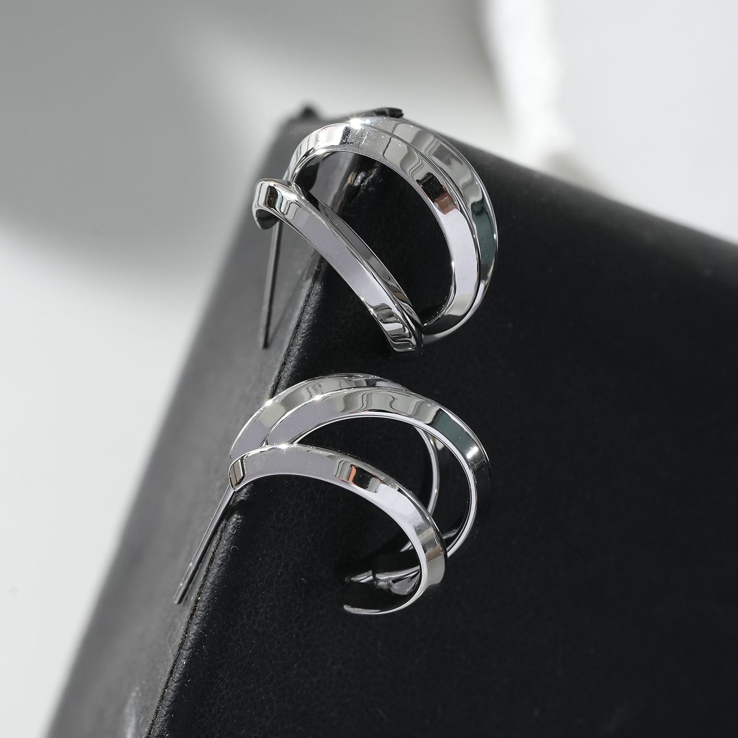 GRIZZANA: Triple Banded Hoop Earrings in Silver