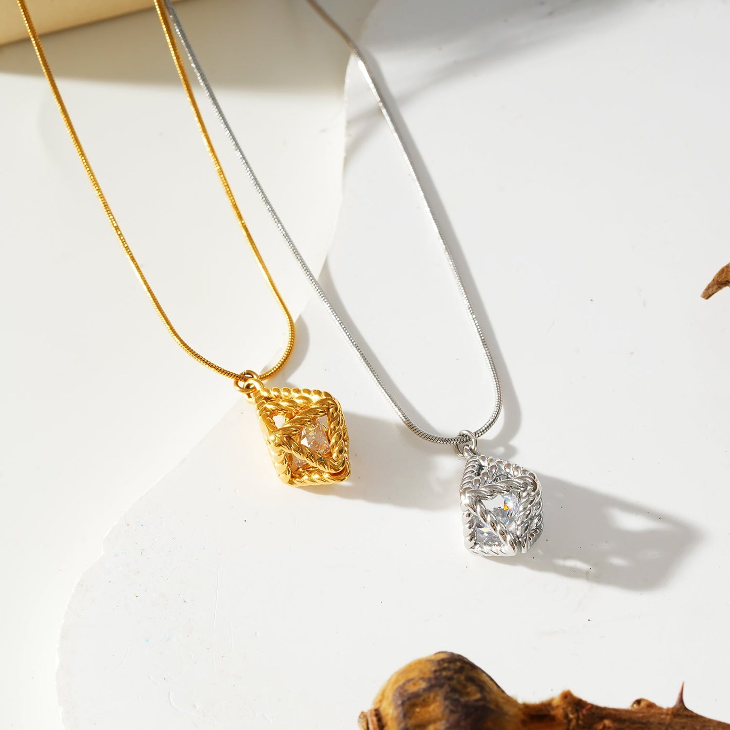 Style KARJAT: Gold Chain Necklace with Geometric Caged Zirconia Pendant