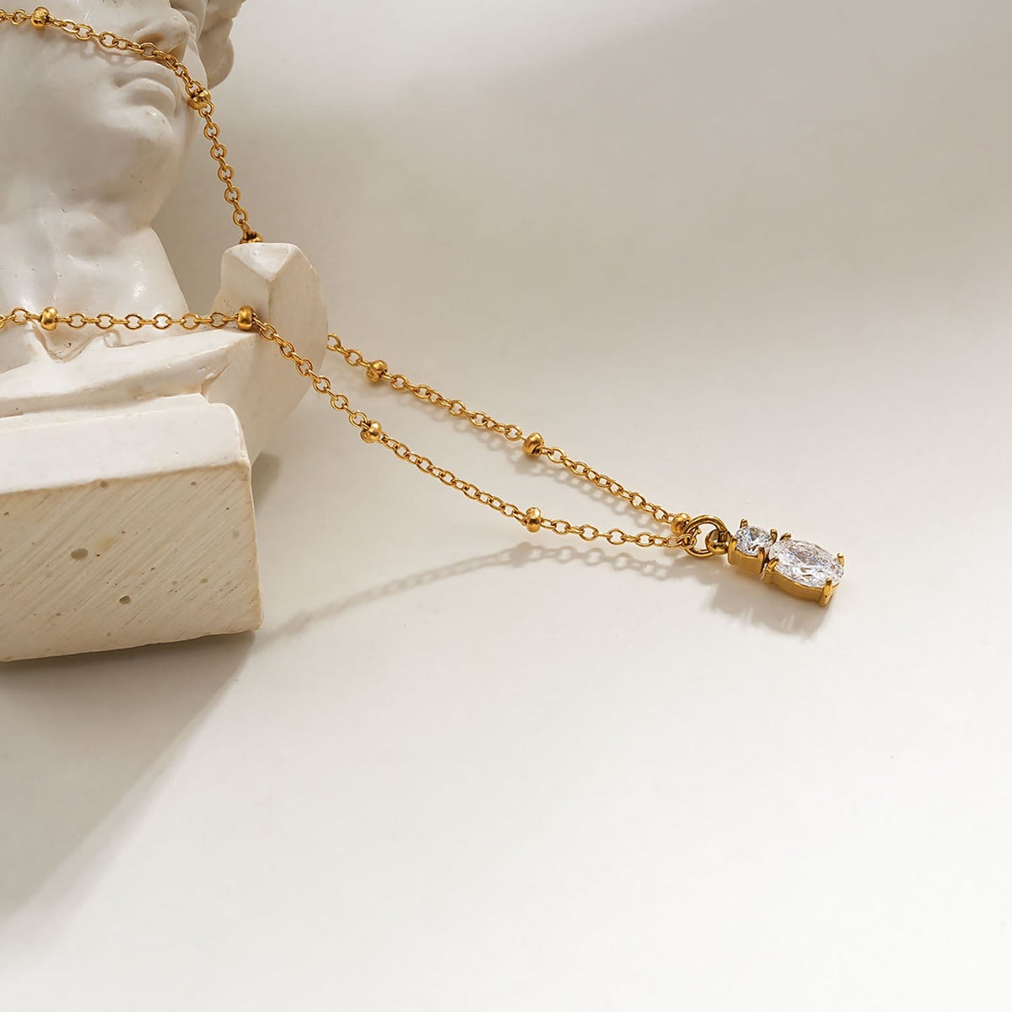 CABBANA Gold:  A Duo Set of Zirconia Charm Pendants on a Beaded Chain Necklace