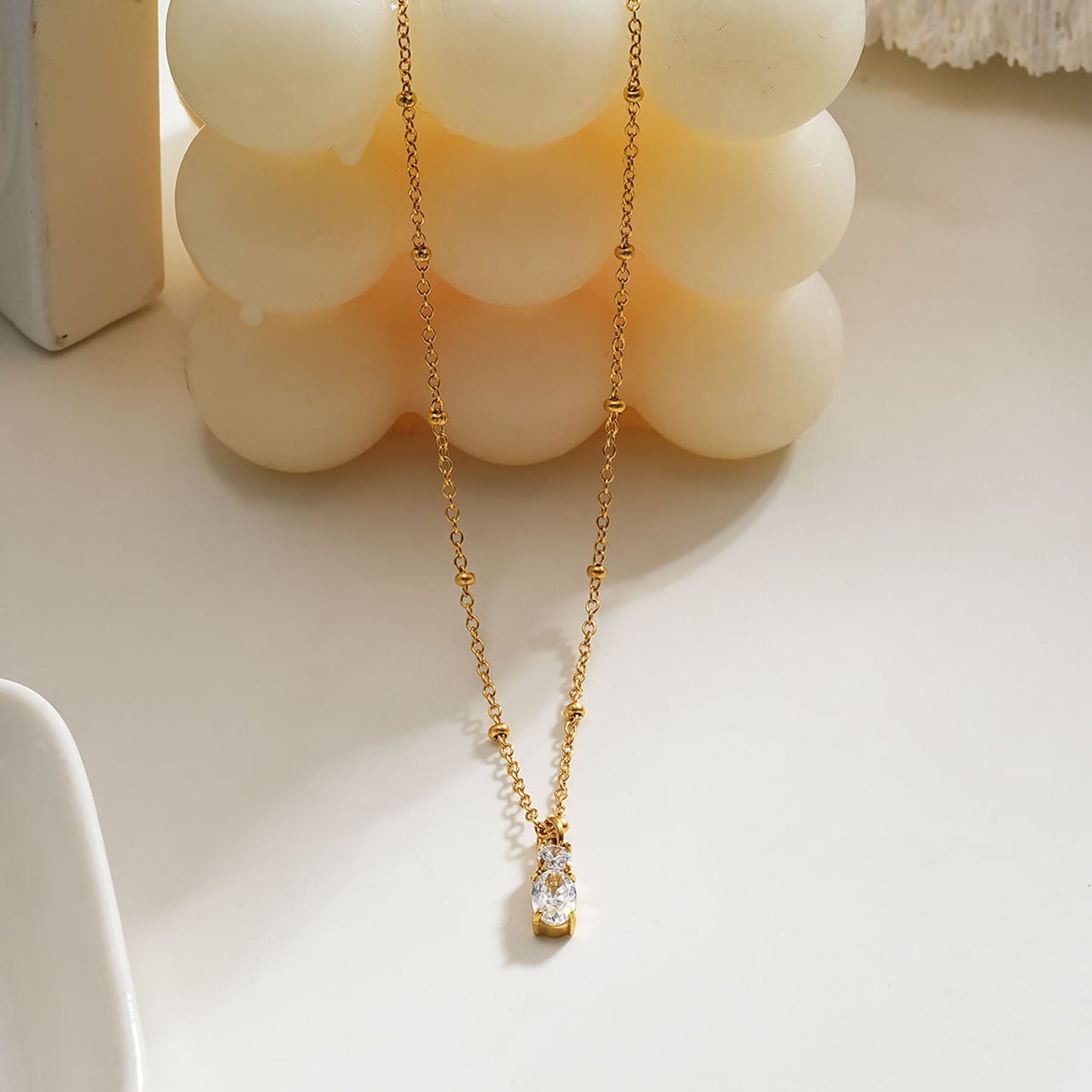 CABBANA Gold:  A Duo Set of Zirconia Charm Pendants on a Beaded Chain Necklace