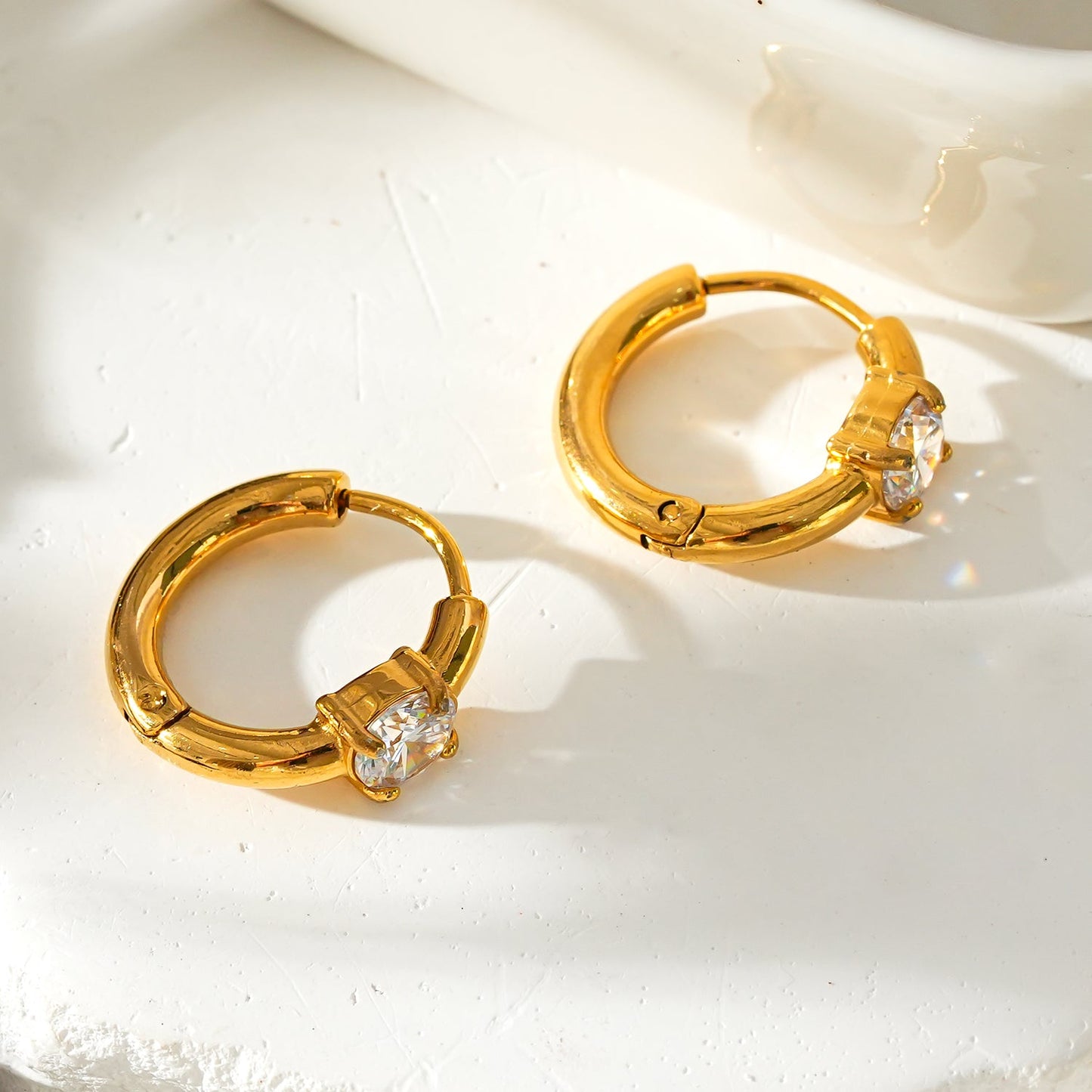 Style GALENA Gold: Mini Hoop Gold Earrings with a Rounded Moissanite Stone