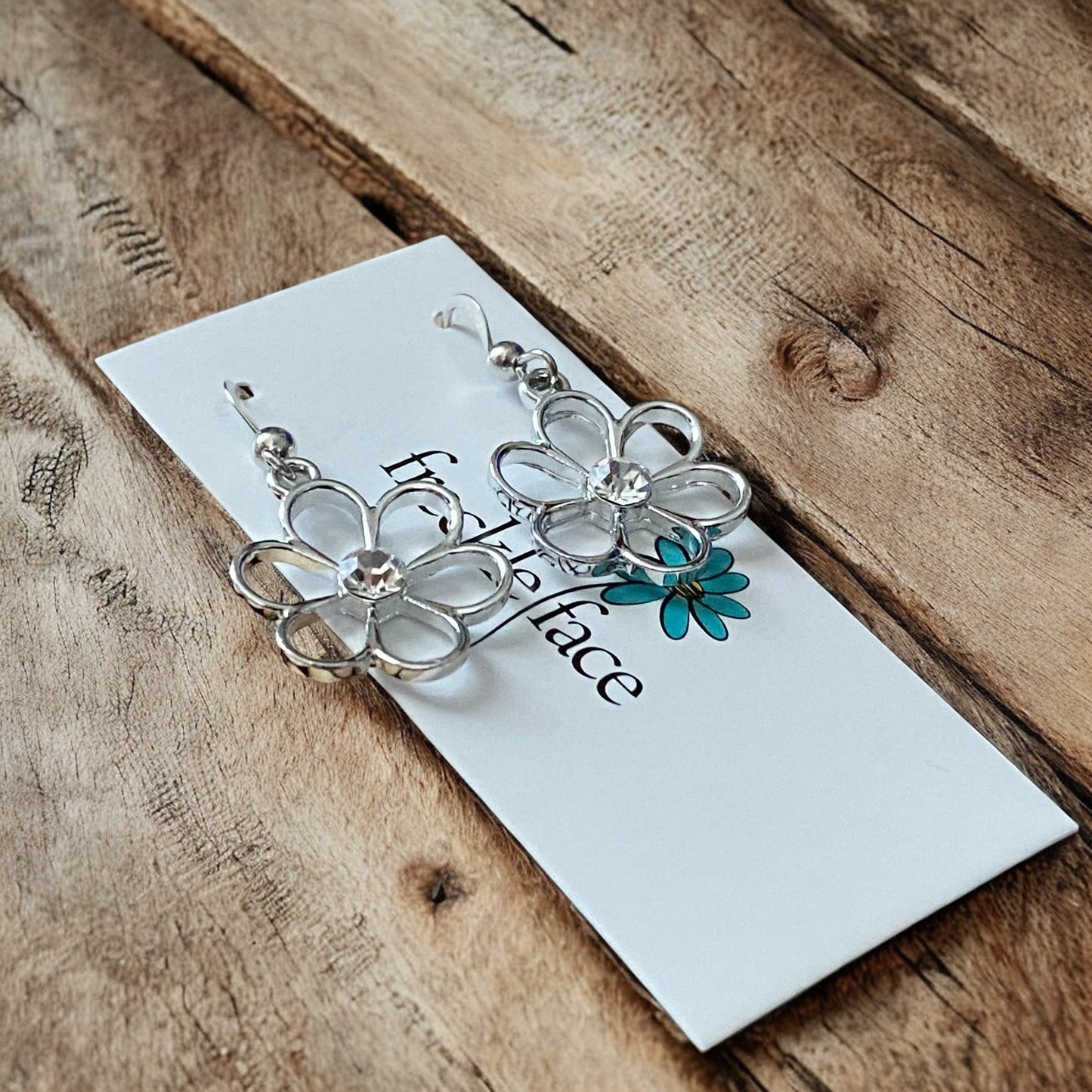 Cutie Patootie Flower Earrings – Silver Floral Dangles with Rhinestone Center