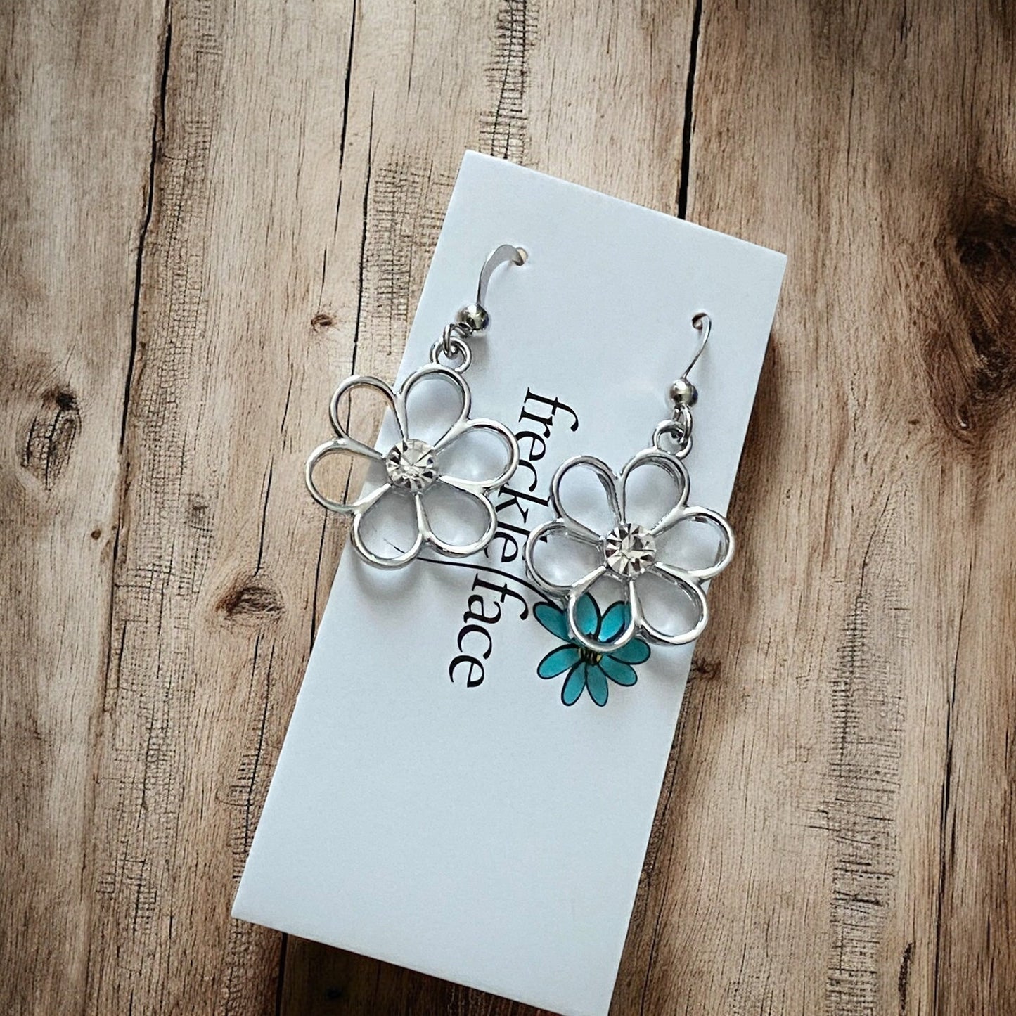 Cutie Patootie Flower Earrings – Silver Floral Dangles with Rhinestone Center