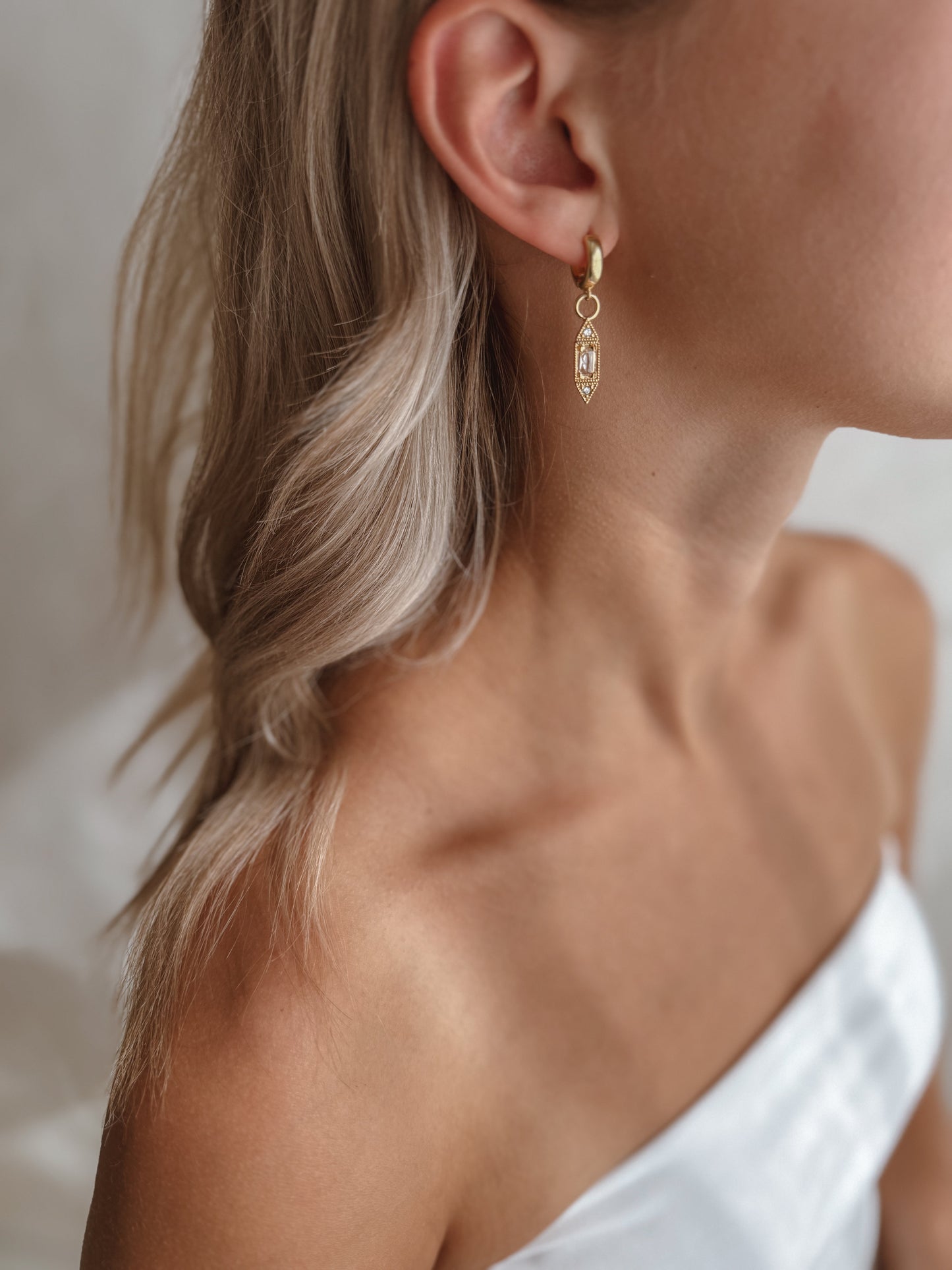 The Celeste Huggie Hoop Earrings
