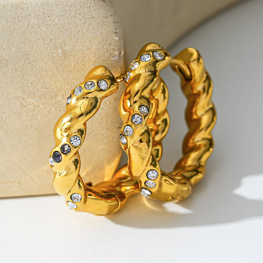 Style KAMENZ: Twisted Textured Hoop Earrings with Zirconia Embellishments.