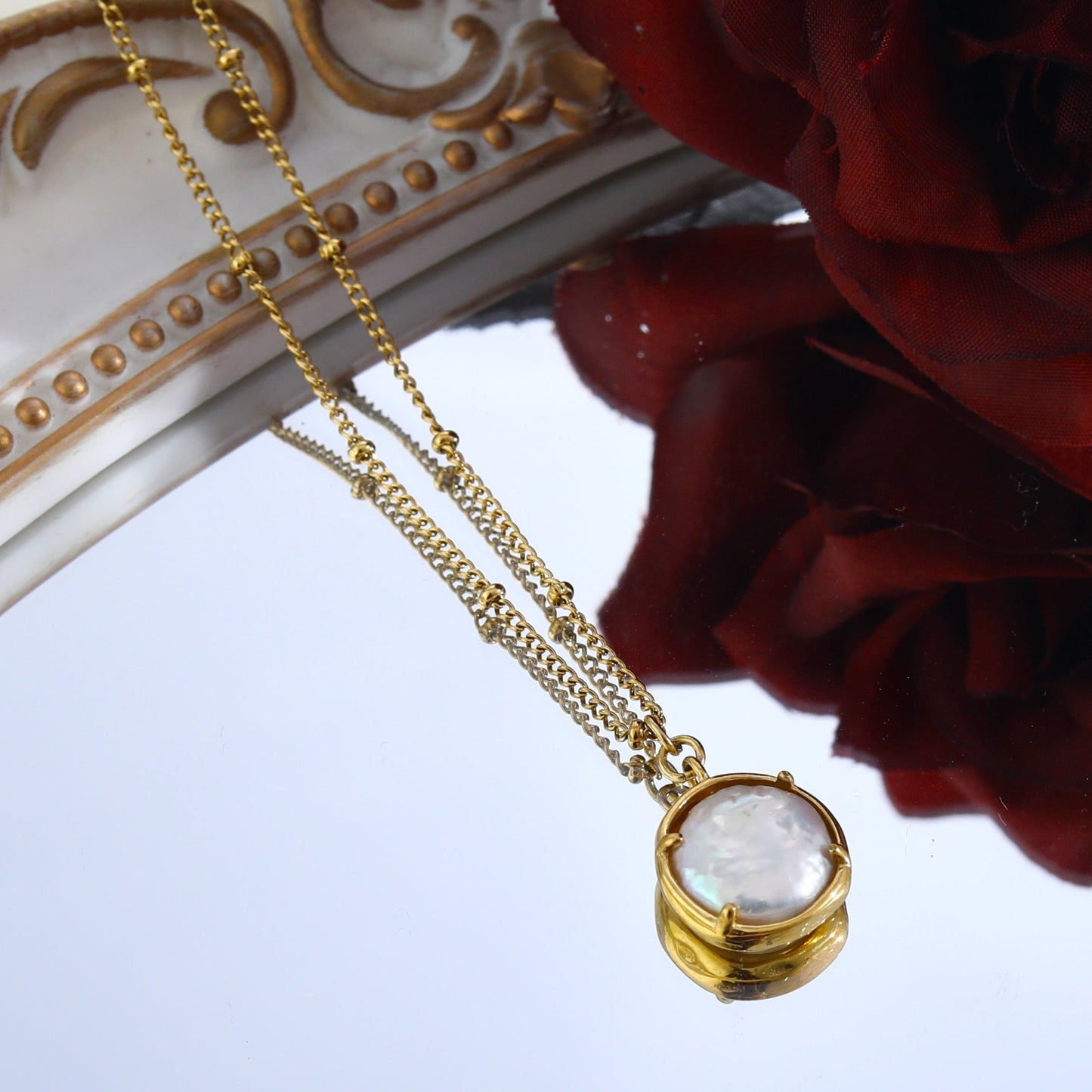 LERATI: Beaded Chain with an Encased Fresh Water Pearl Pendant in Gold