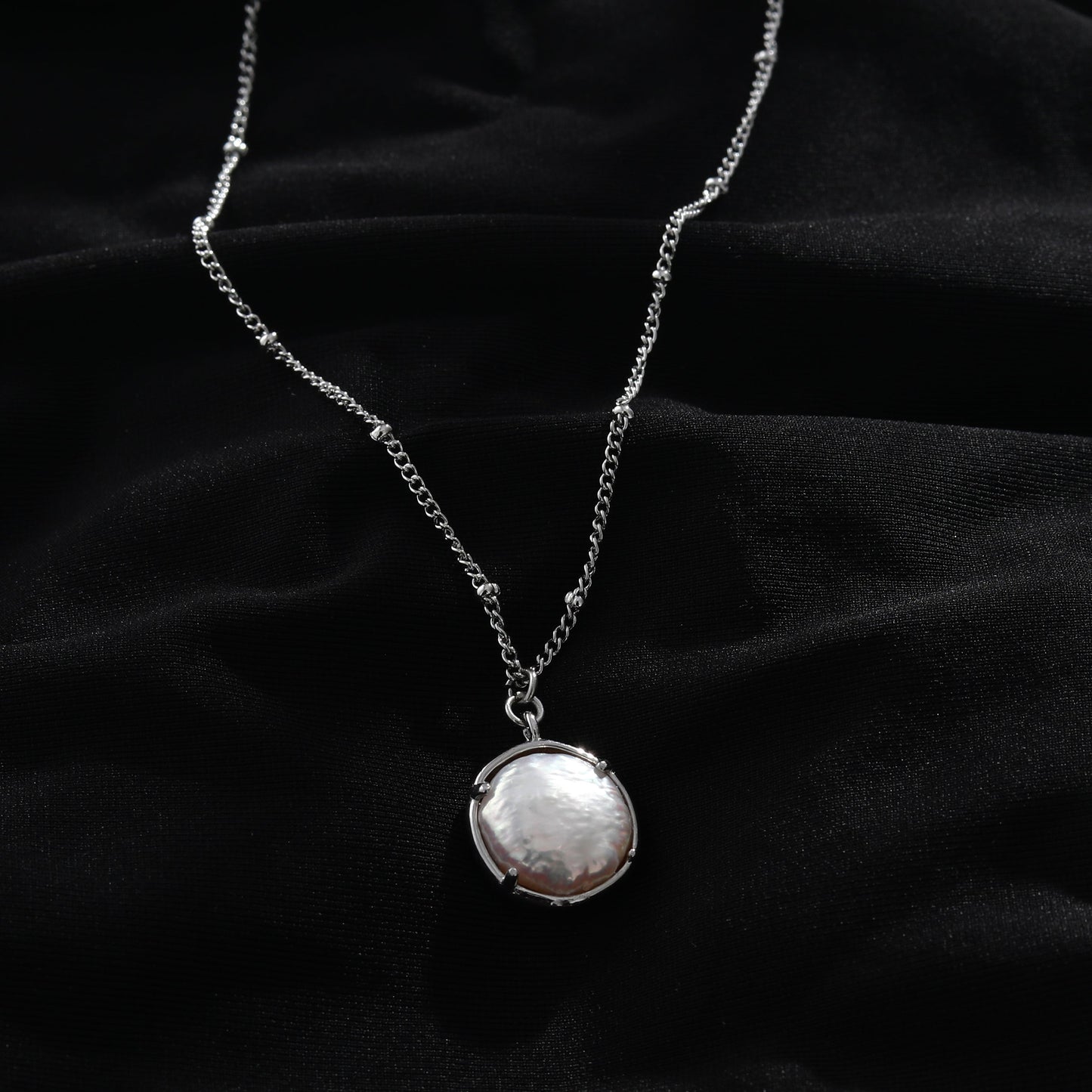LERATI Beaded Chain with an Encased Fresh Water Pearl Pendant in Silver