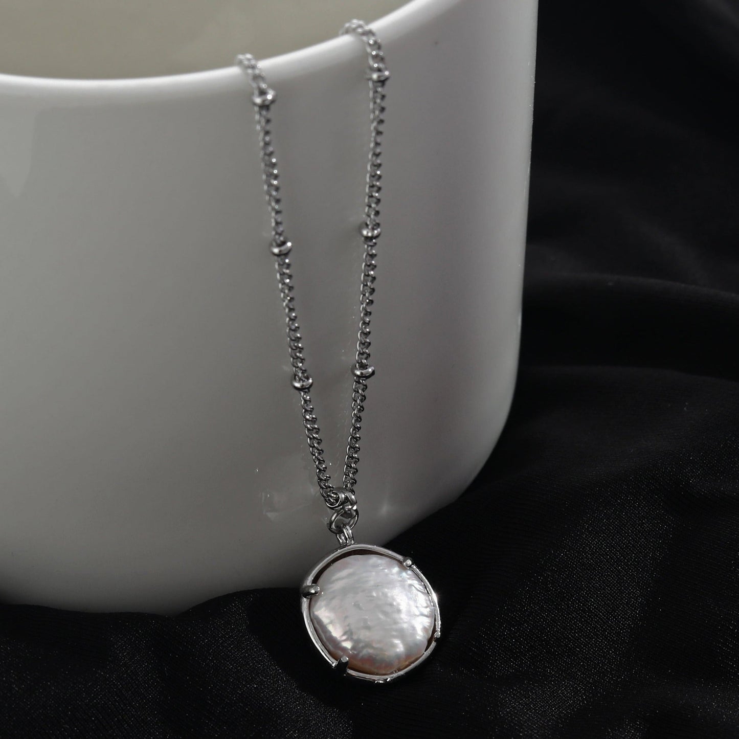 LERATI Beaded Chain with an Encased Fresh Water Pearl Pendant in Silver