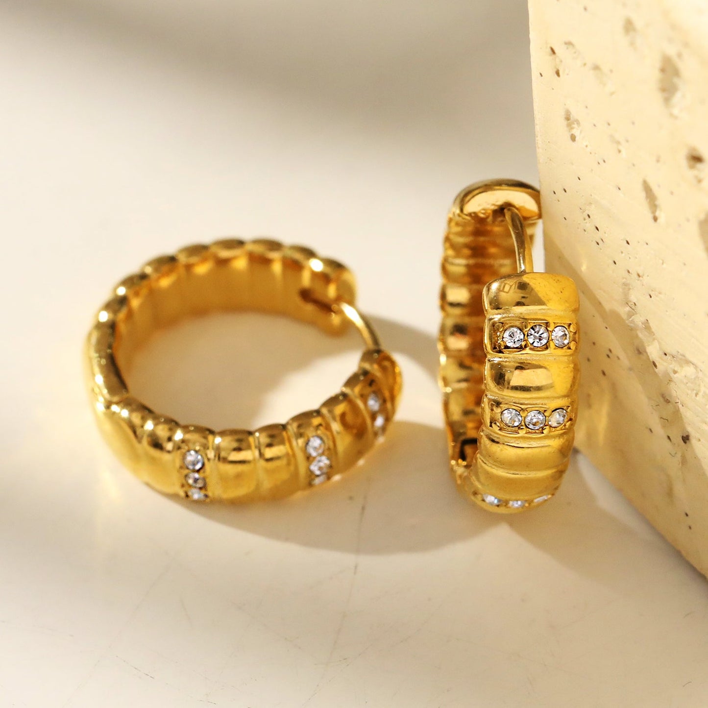 LIZBETH: Sculpted Hoop Earrings with Zirconia Embellishments.