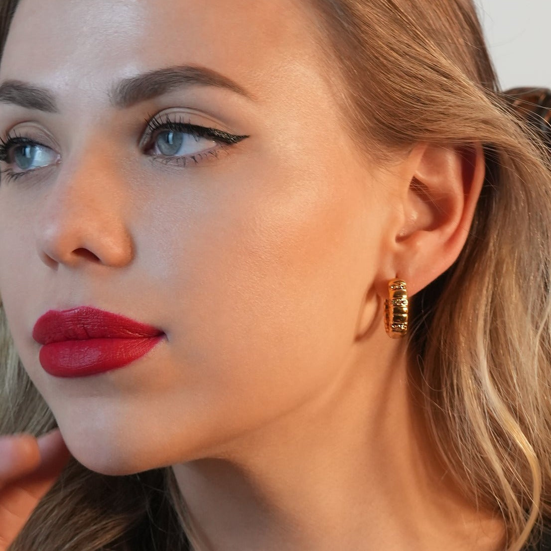 LIZBETH: Sculpted Hoop Earrings with Zirconia Embellishments.