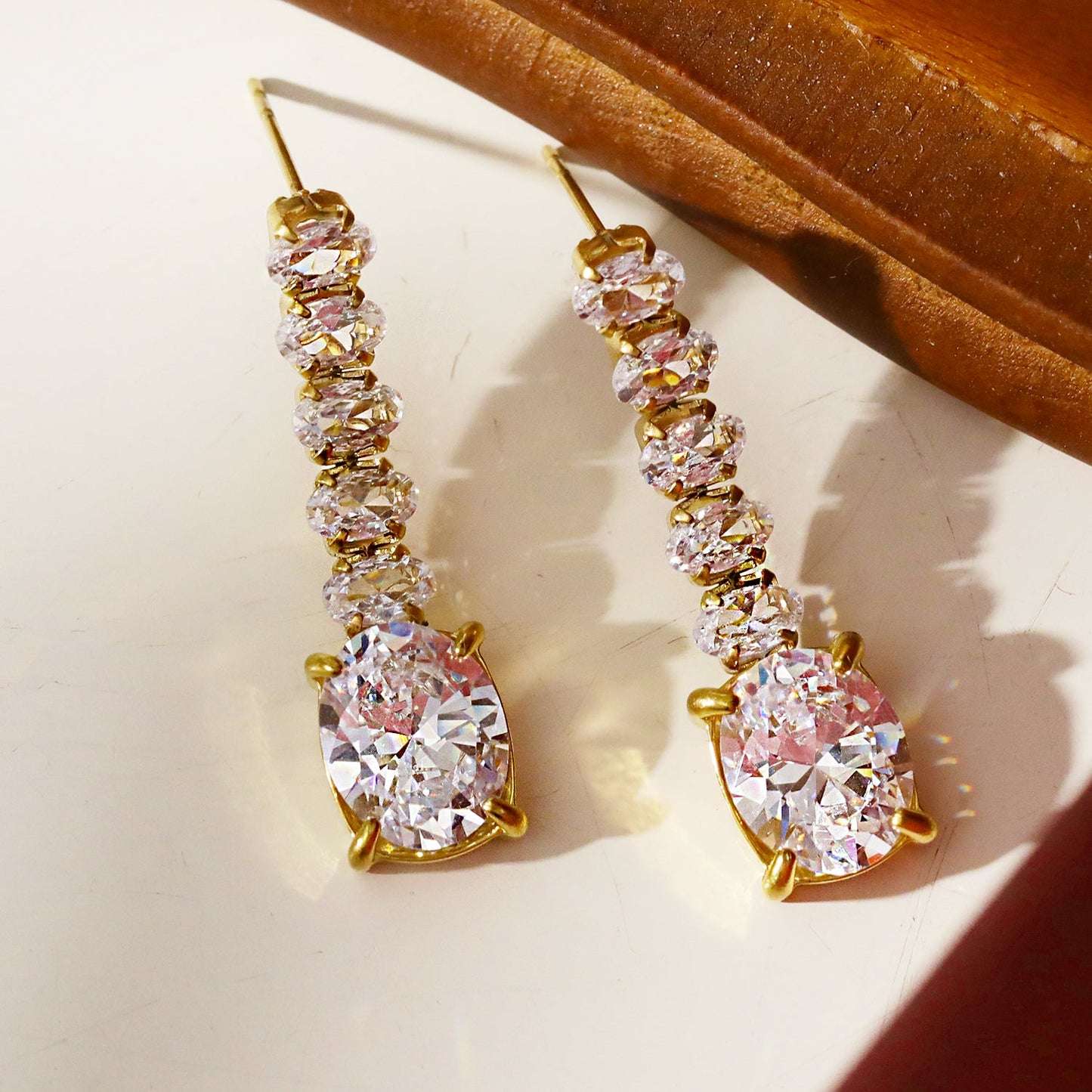 MALIA: Radiant Cascading Zirconia Drop Earrings