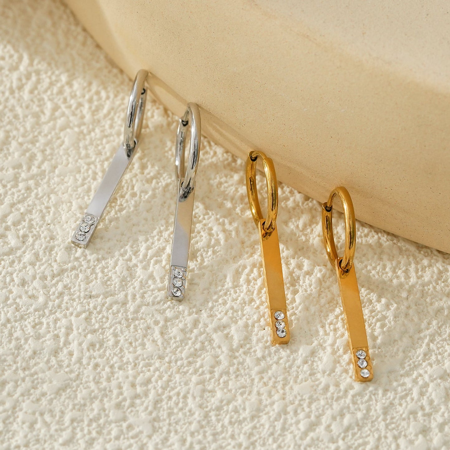 Style MAYLA: Gold Hoops with a Minimalist Charm featuring a Trio of Zirconia Gemstones