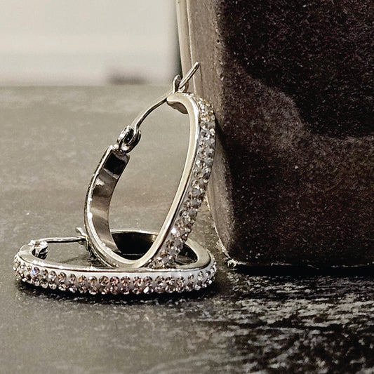 Style MELFI Silver: Abstract Heart Shaped Hoops embedded with Zirconia Gemstones