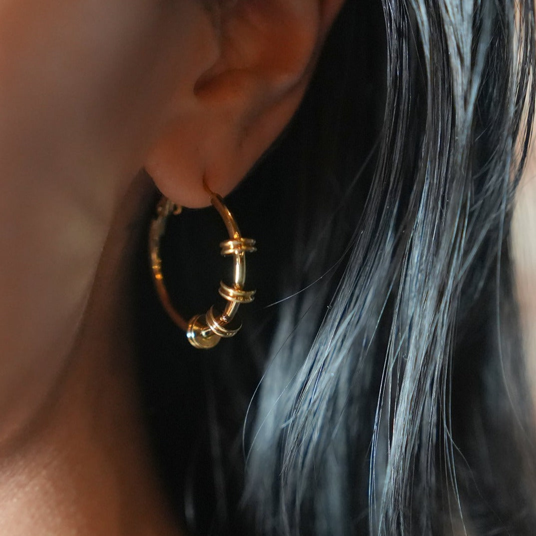 MINATO: Modernist Hoop Earrings Anchoring Industrial-Chic Double Discs.