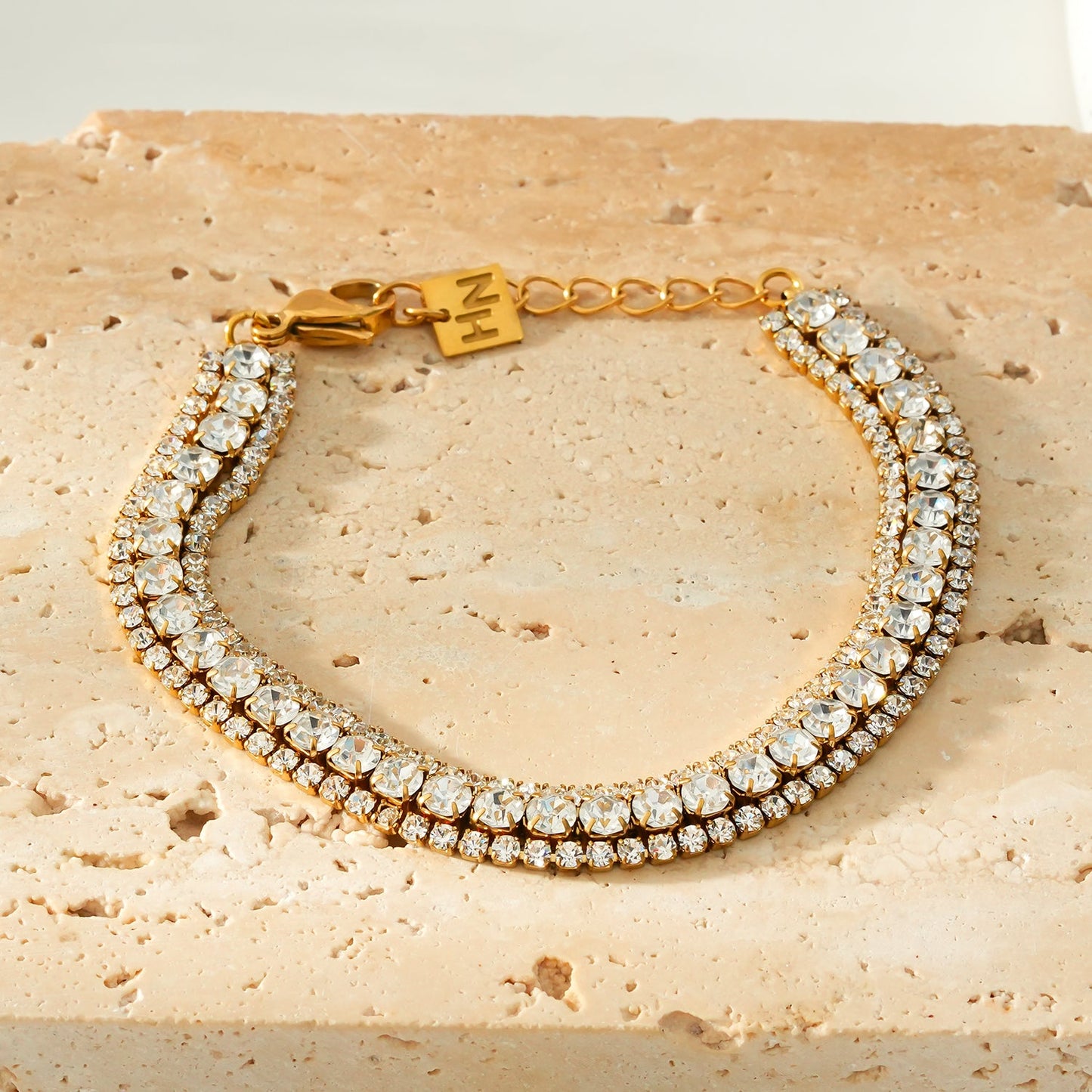 NANDAMA Gold: Triple Layered - Three-Row Zirconia (CZ) Tennis Bracelet with Bold Centerpiece. Stacked for Glamour.