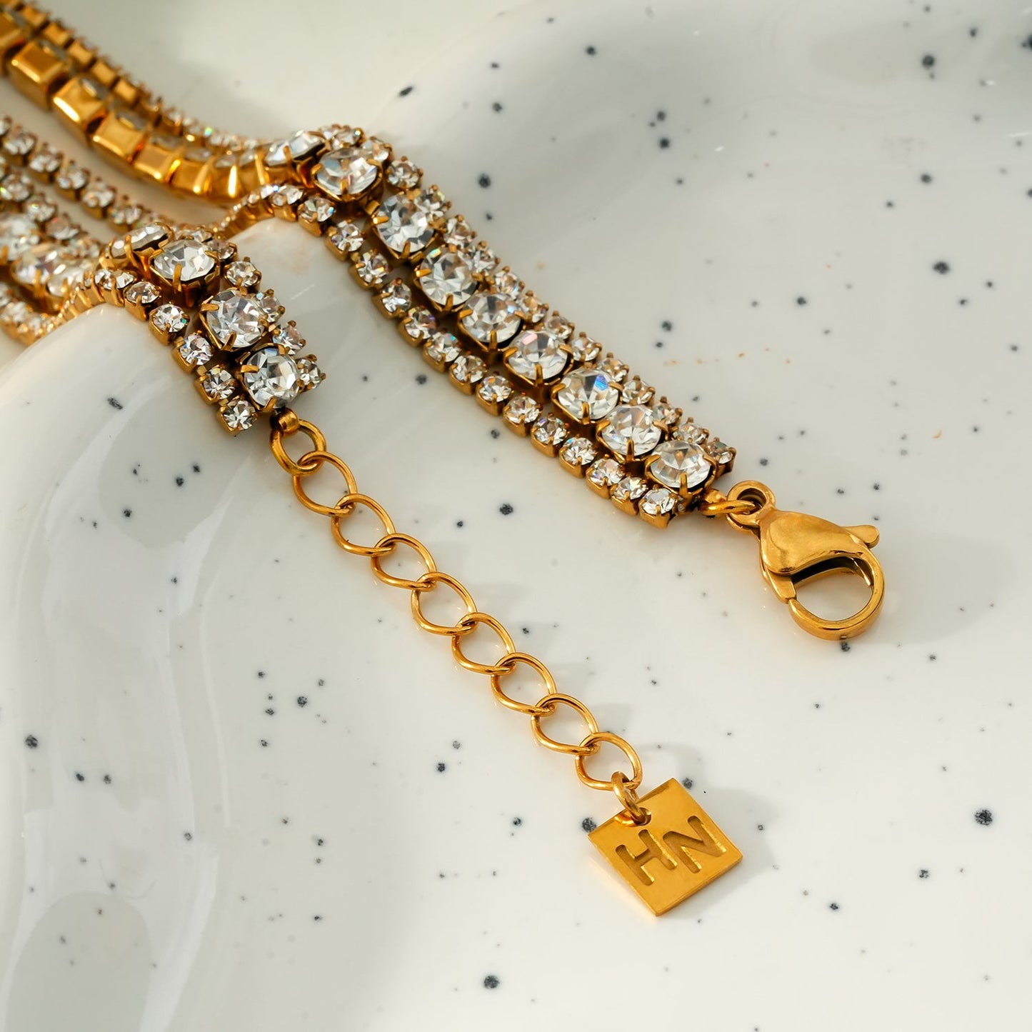 NANDAMA Gold: Triple Layered - Three-Row Zirconia (CZ) Tennis Bracelet with Bold Centerpiece. Stacked for Glamour.