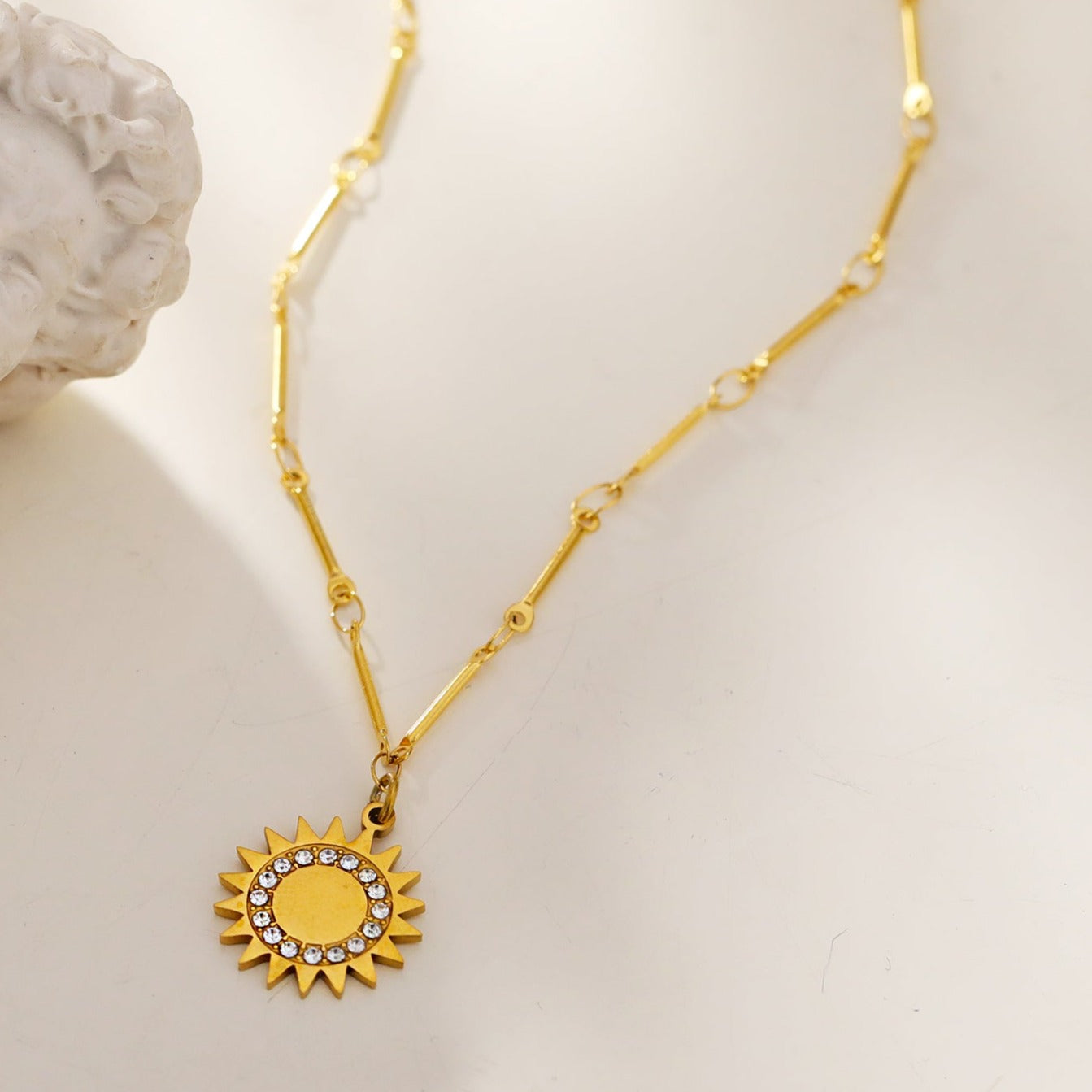 NOMIA Gold: Radiant Sunburst Pendant Zirconia Chain Necklace