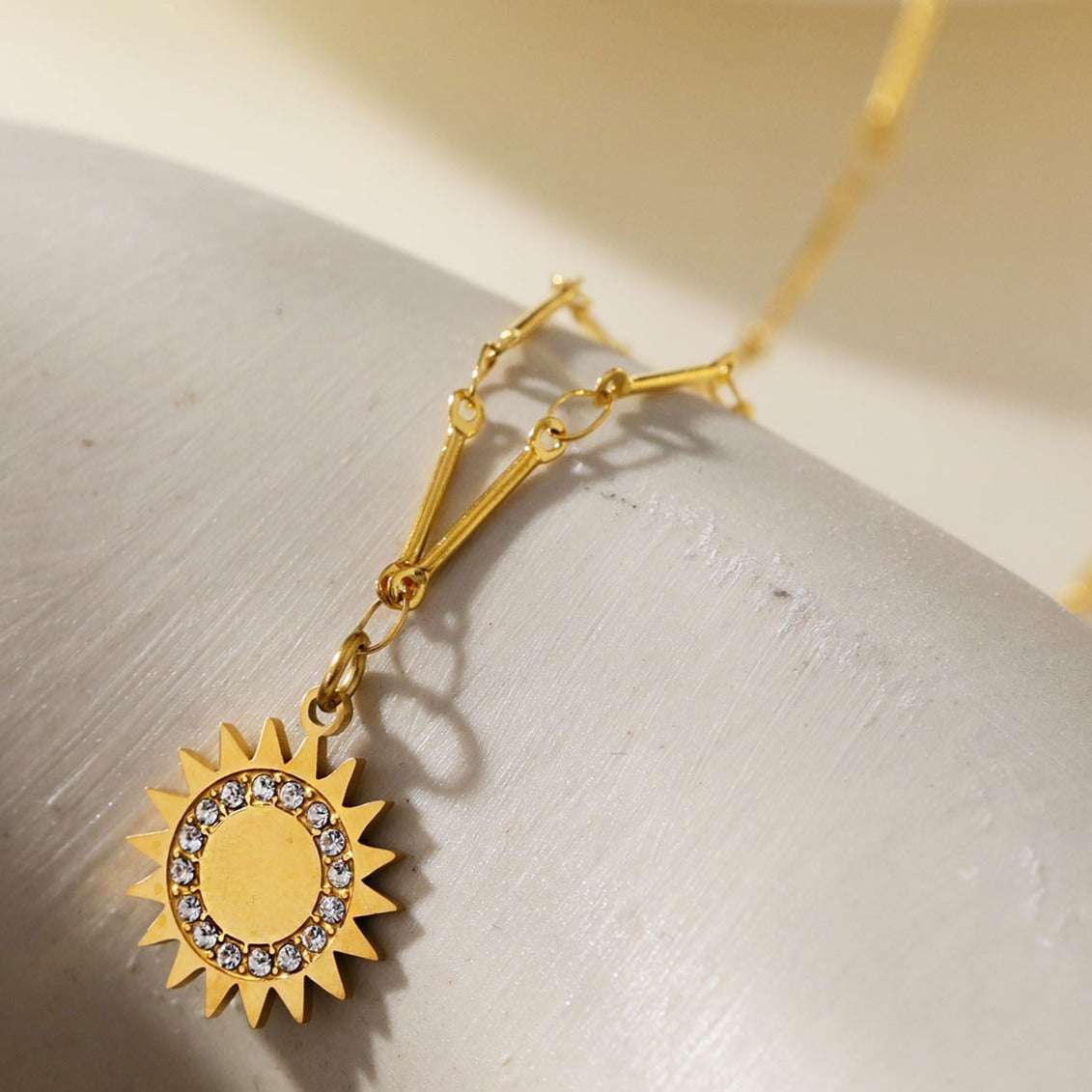 NOMIA Gold: Radiant Sunburst Pendant Zirconia Chain Necklace