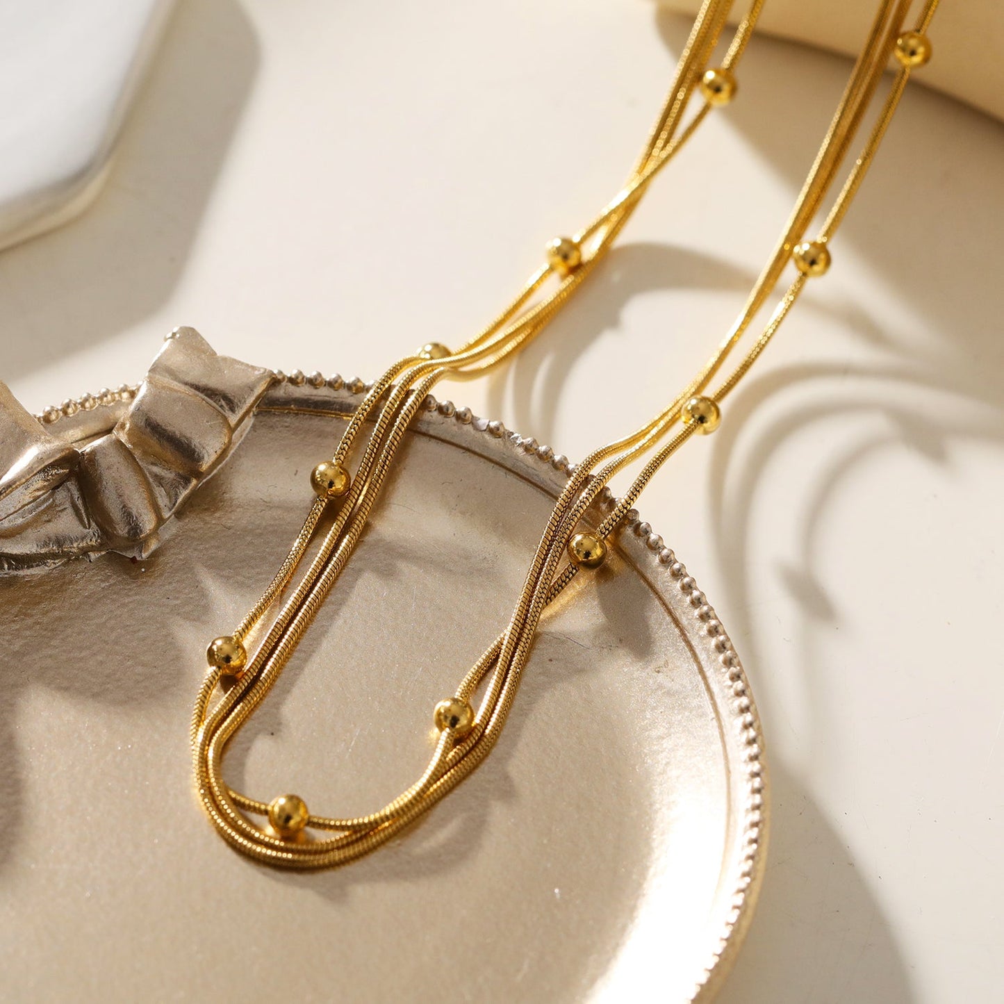 KAKIA: Triple Snake-Skin Chain Layered Necklace with Ball-Bead Accents