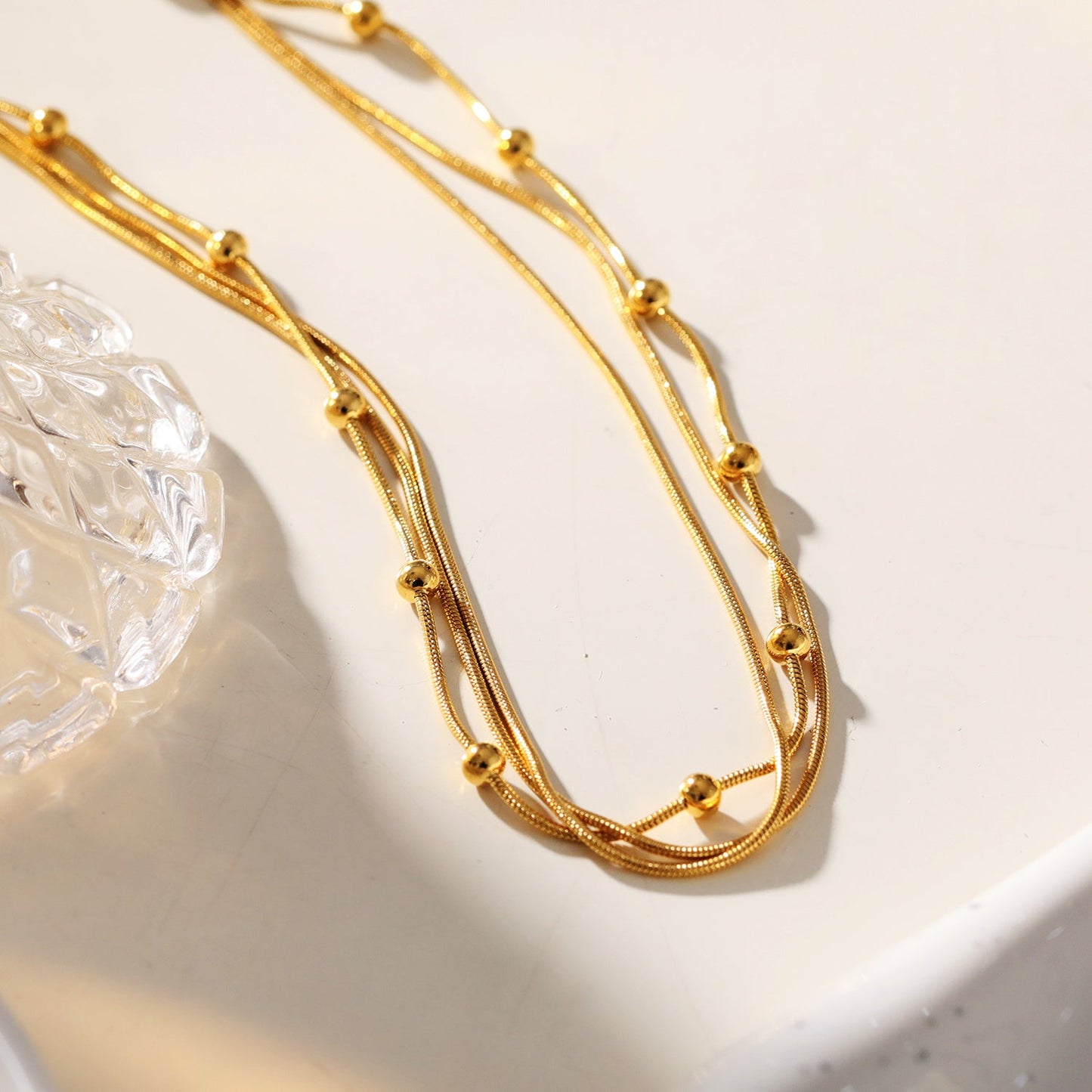 KAKIA: Triple Snake-Skin Chain Layered Necklace with Ball-Bead Accents