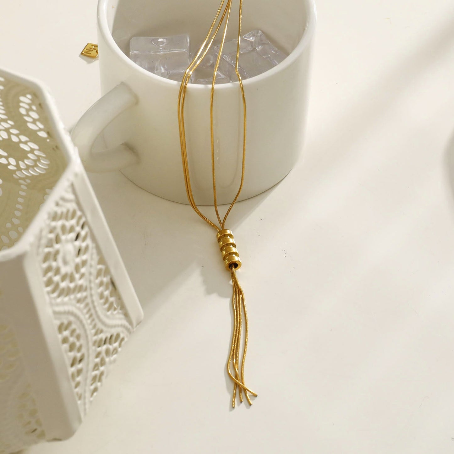 TELMA: Lariat Style Multi Stranded Necklace.