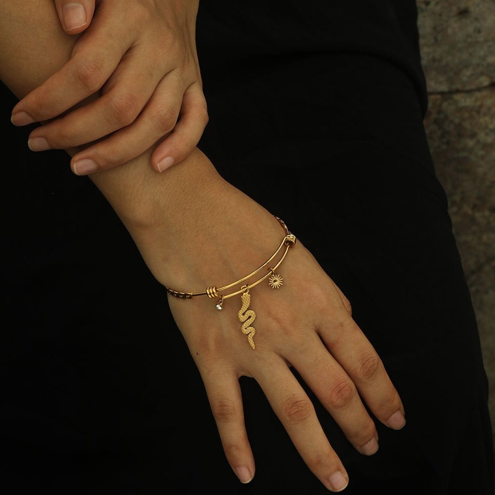 CATALINA Gold: Bracelet with Serpent, Sun Symbol and Zirconia (CZ) Charms